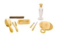 An American 18 Karat Gold Mounted Nine-Piece Dressing Set, Tiffany & Co., New York, NY, Circa 1925, all engraved with an art deco monog