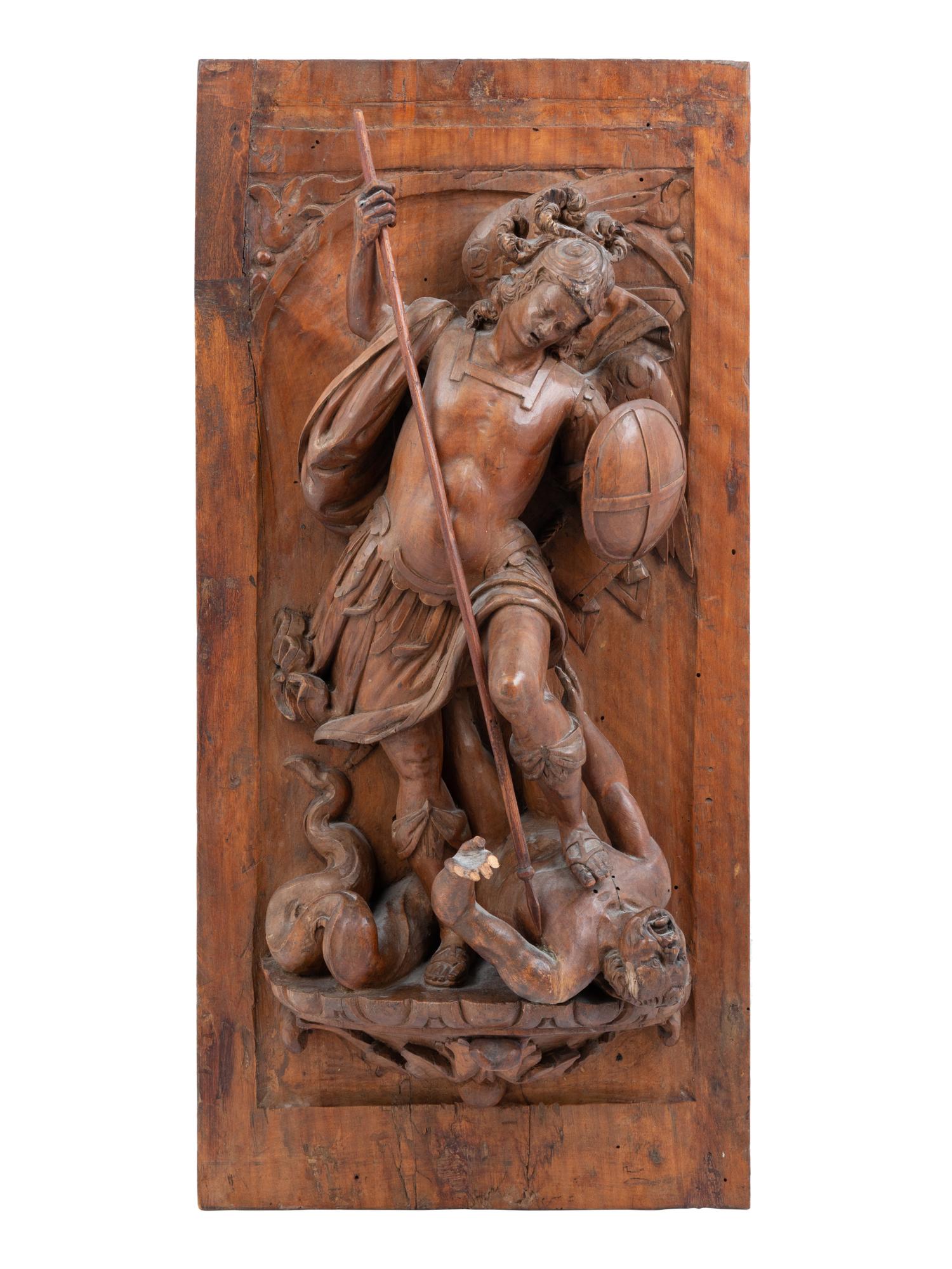 A Continental Carved Walnut Panel