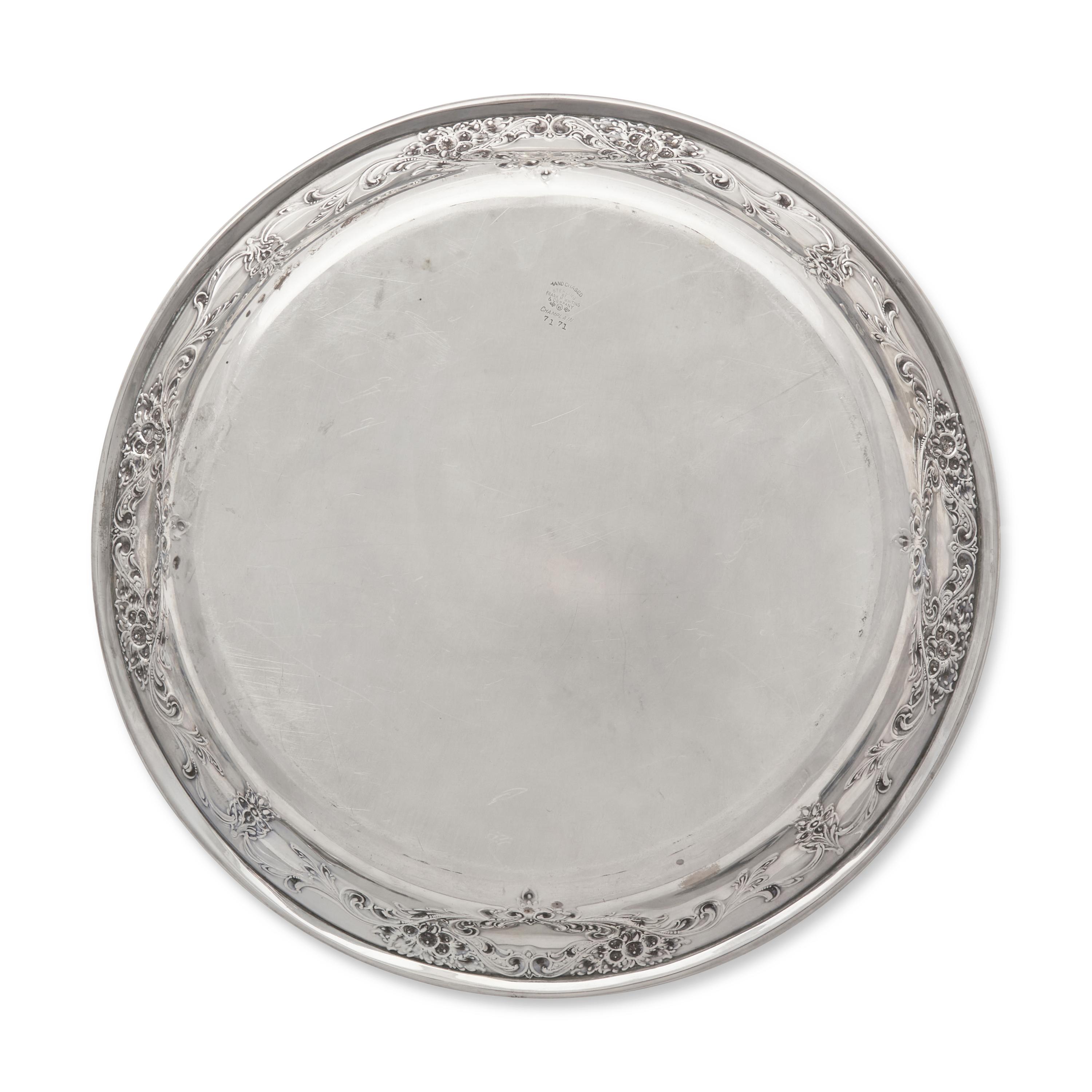 A Sterling Silver Floral Repousse Dished Tray in the Champlain Pattern