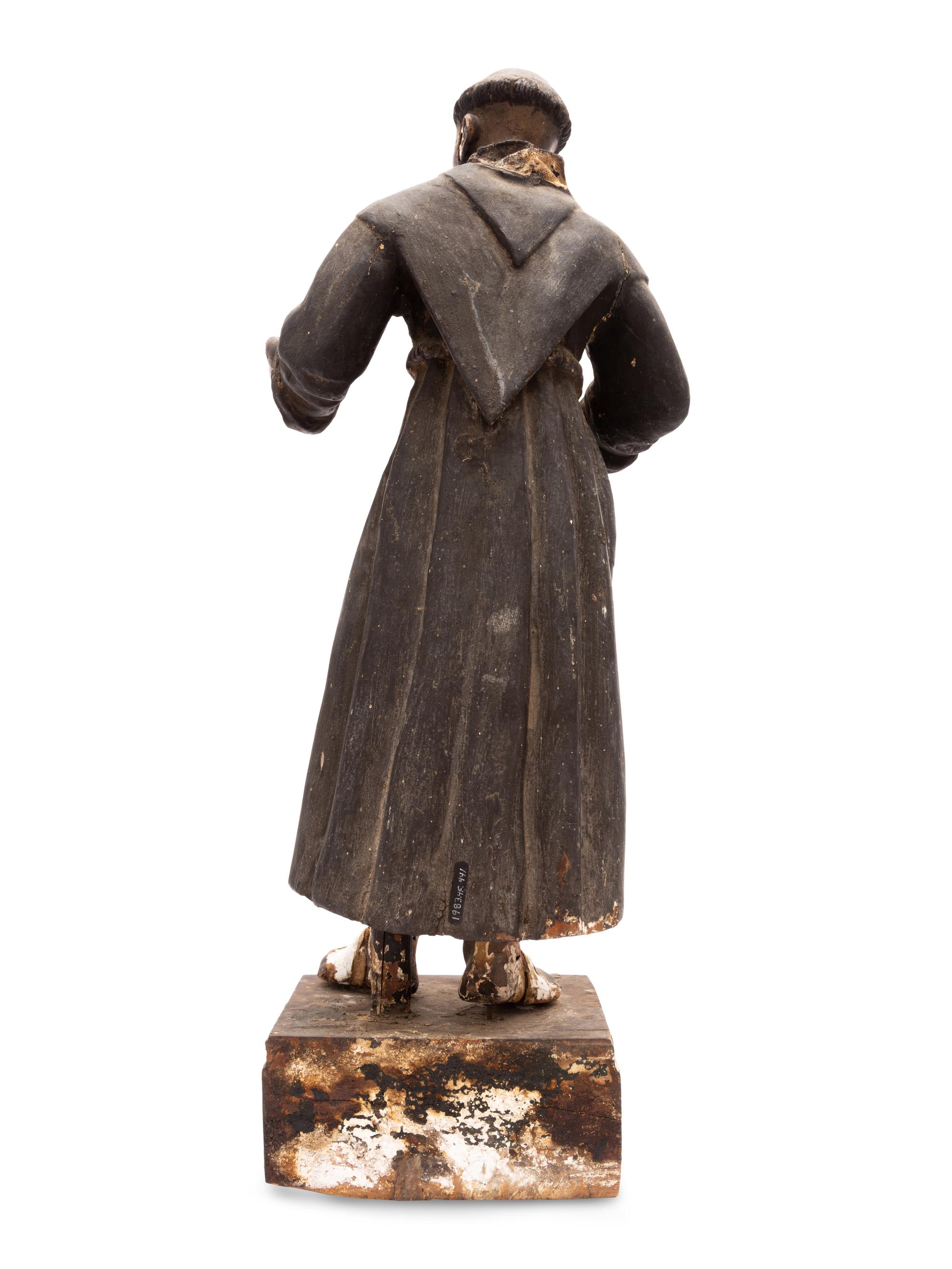 A Spanish Colonial Painted Wood Figure of a Saint