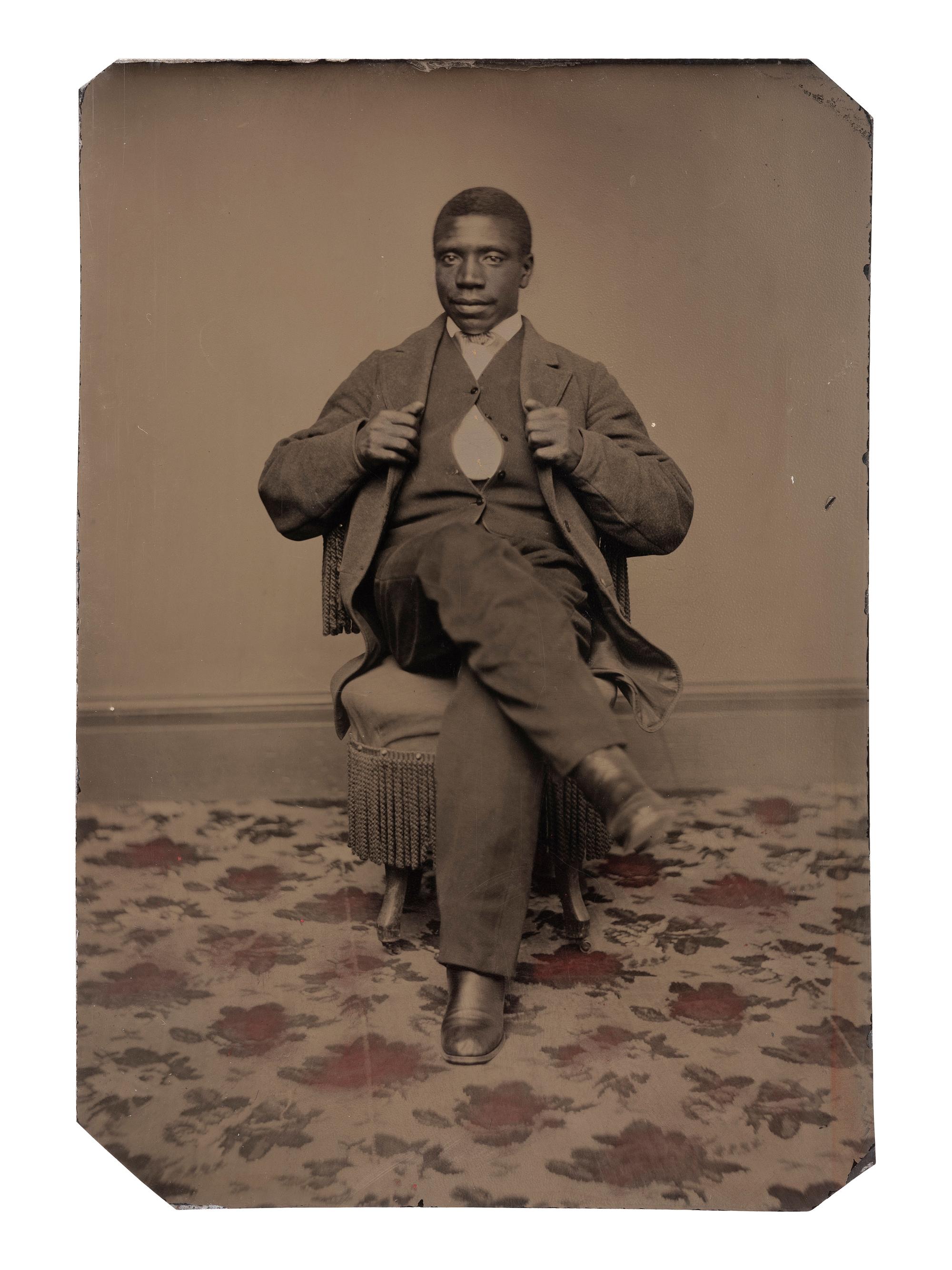 [AFRICAN AMERICANA - EARLY PHOTOGRAPHY]. Tintype portrait of a well-dressed African American male subject identified as "Joseph Montgomery."