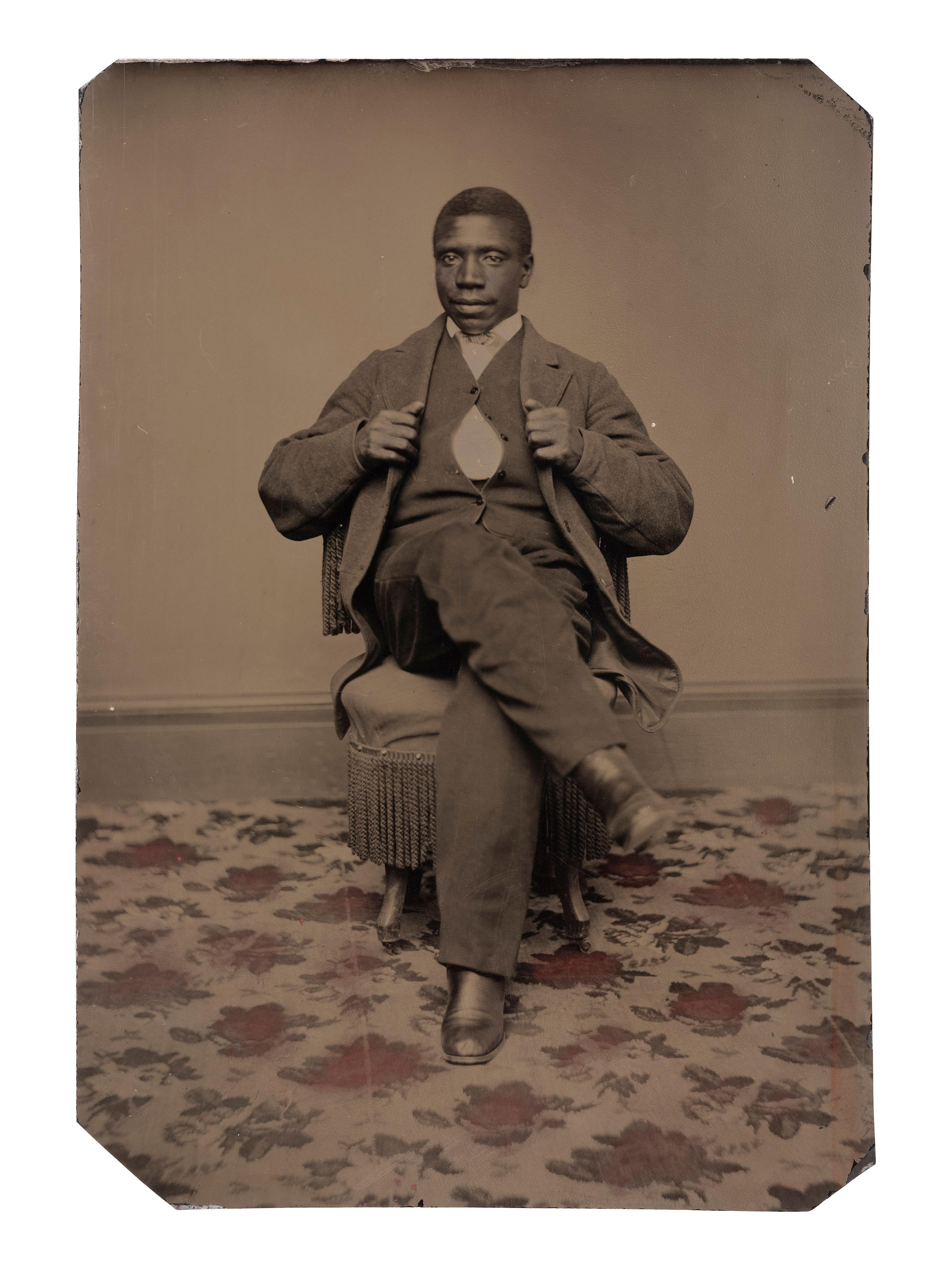 [AFRICAN AMERICANA - EARLY PHOTOGRAPHY]. Tintype portrait of a well-dressed African American male subject identified as "Joseph Montgomery."