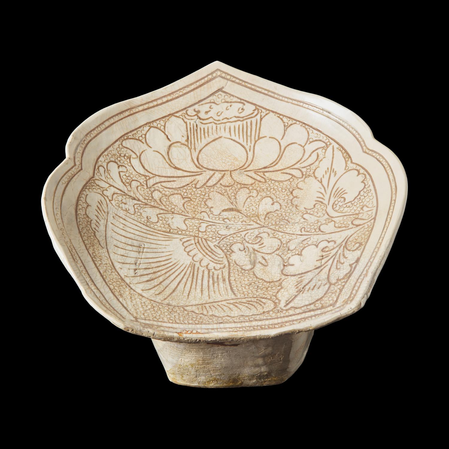 A Chinese Cizhou Stoneware 'Lotus' Pillow, Northern Song/Jin Dynasty 北宋/金 磁州窰珍珠地劃花蓮紋瓷枕