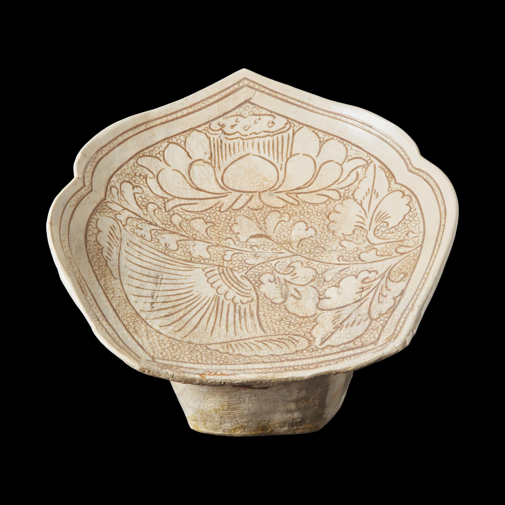 A Chinese Cizhou Stoneware 'Lotus' Pillow, Northern Song/Jin Dynasty 北宋/金 磁州窰珍珠地劃花蓮紋瓷枕