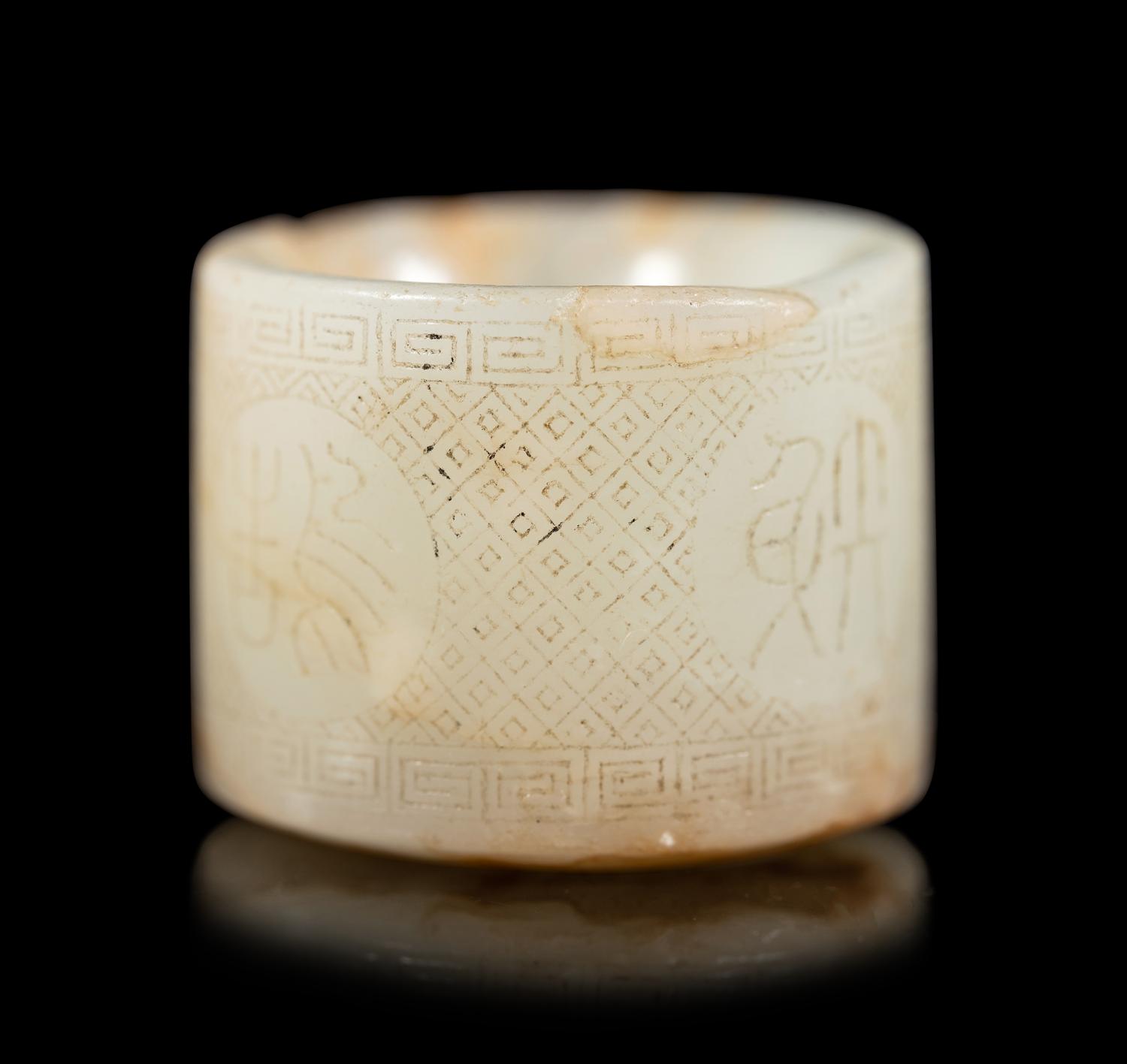 An Incised White Jade Archer's Ring