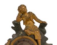 A Charles X Gilt and Patinated Bronze Figural Mantel Clock