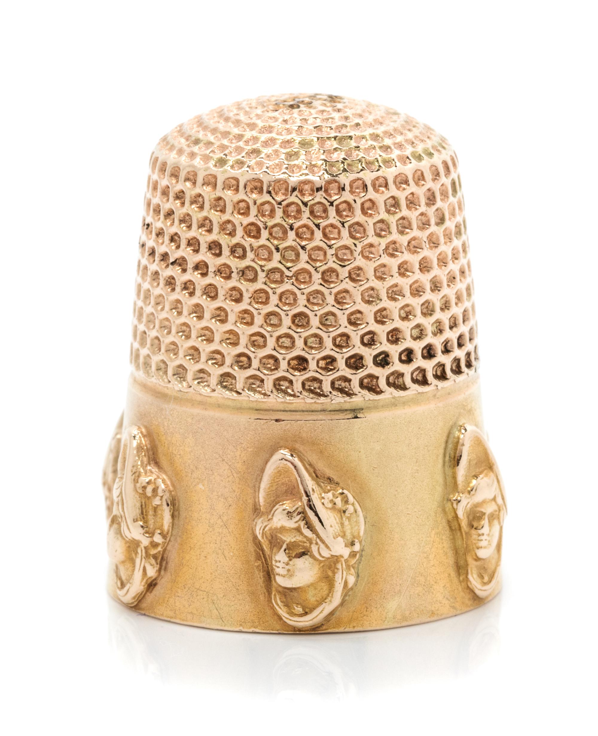 An American 14-Karat Yellow Gold Dolly Varden Thimble, Goldsmith, Stern & Co., New York, NY, the knurled top and body above a plain ban