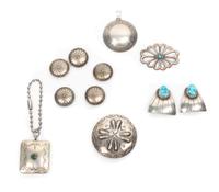 Nine Southwestern Jewelry Items Diameter of largest pin 1 3/4 inches.