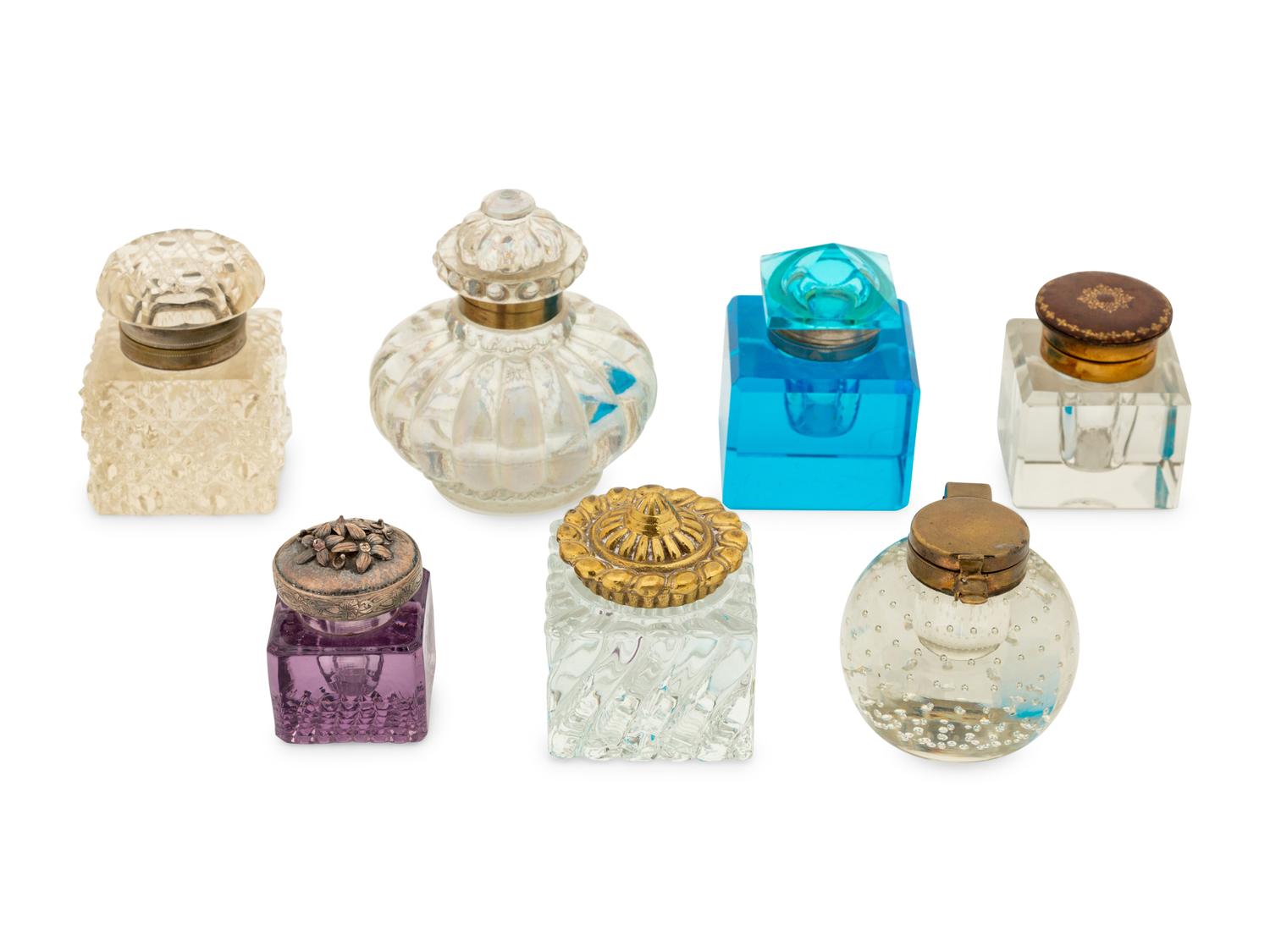 A Group of Brass and Silver Mounted Crystal Inkwells