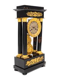 A Charles X Gilt Bronze Mounted Ebonized Fruitwood Clock