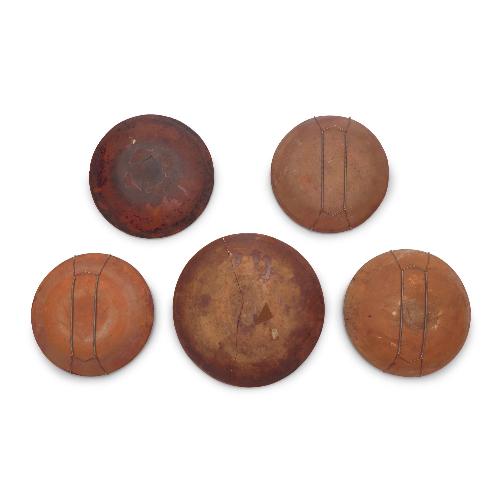 A Group of Five Slip-Decorated Redware Plates