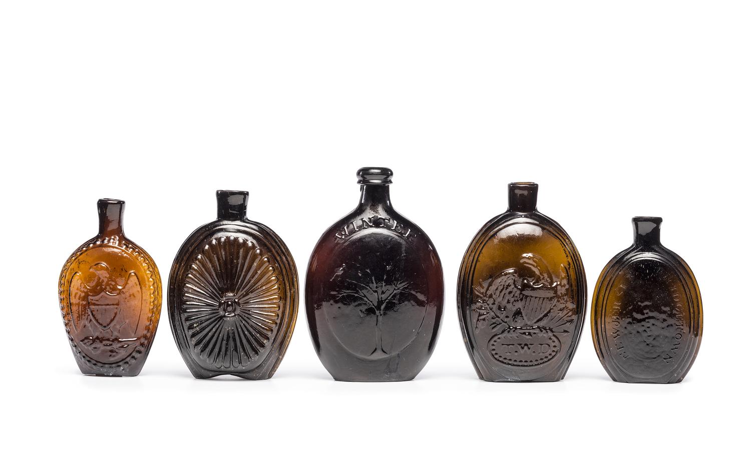 Five Molded Glass Amber Flasks