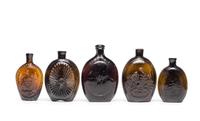 Five Molded Glass Amber Flasks