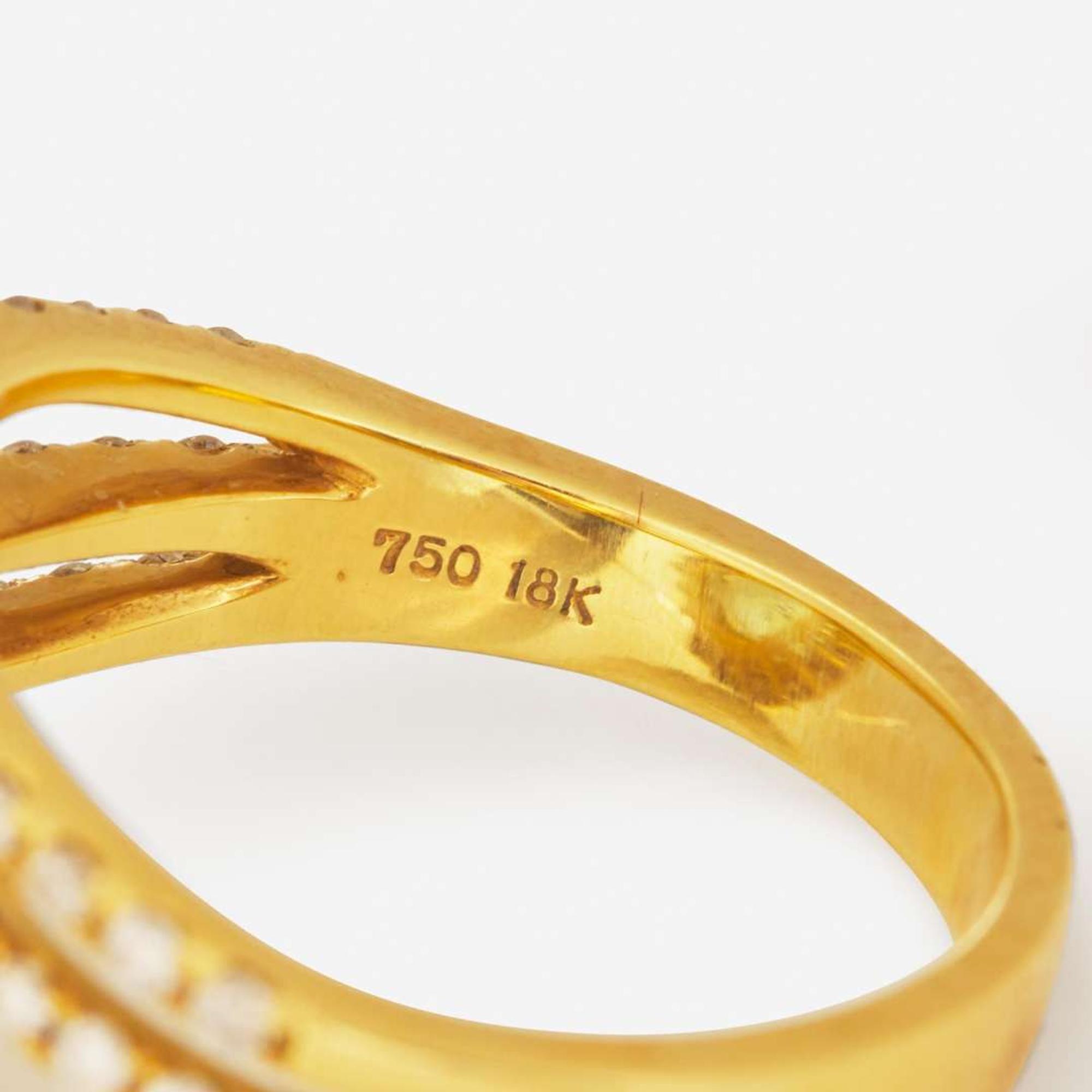 An 18K Yellow Gold, Aquamarine, and Diamond Ring
