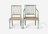 A Set of Ten George III Green and White Painted and Parcel Gilt Lattice Back Dining Chairs