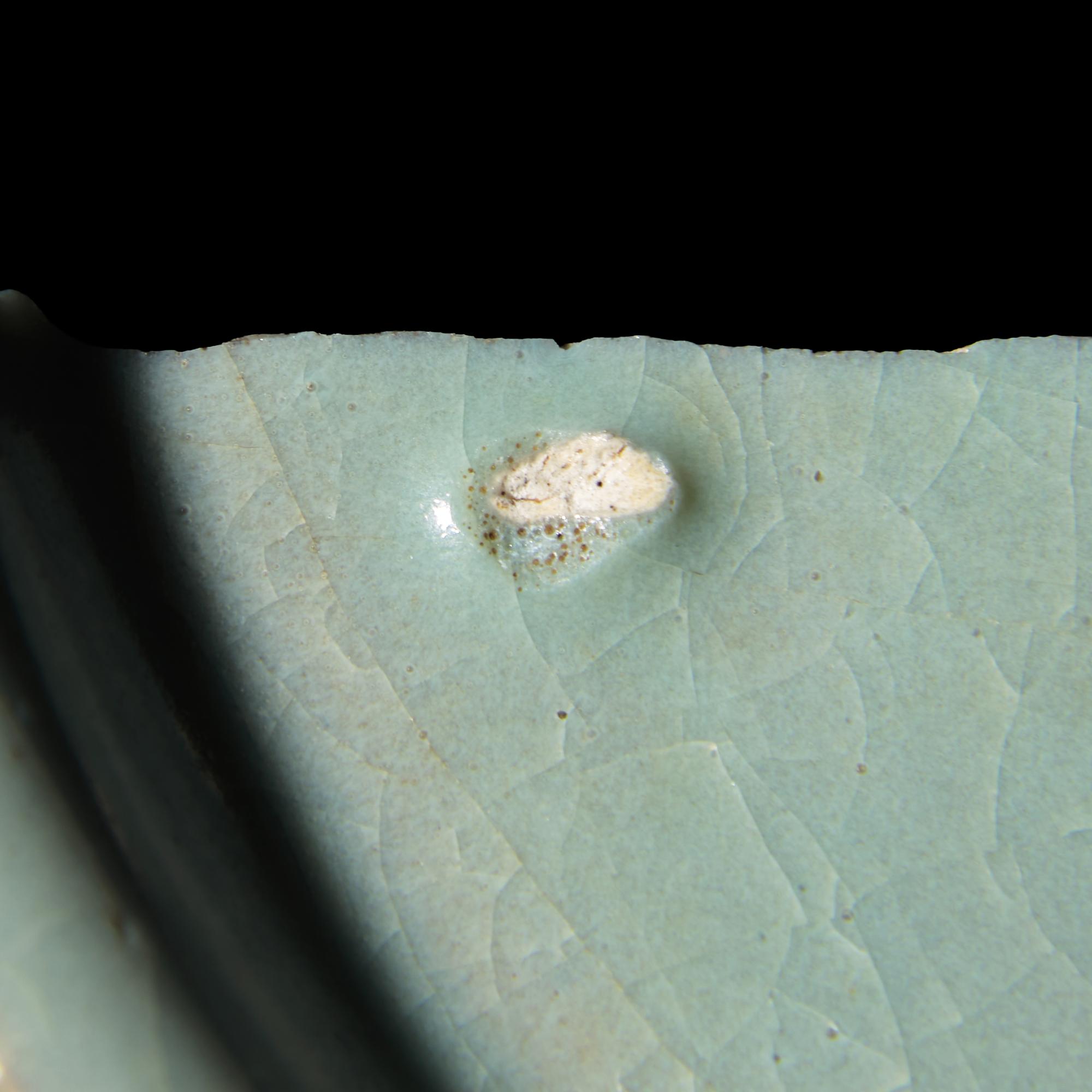 Two Chinese Celadon Glazed Ceramic Fragments, Song Dynasty — 宋 汝窯及官窯帶支釘瓷片兩枚