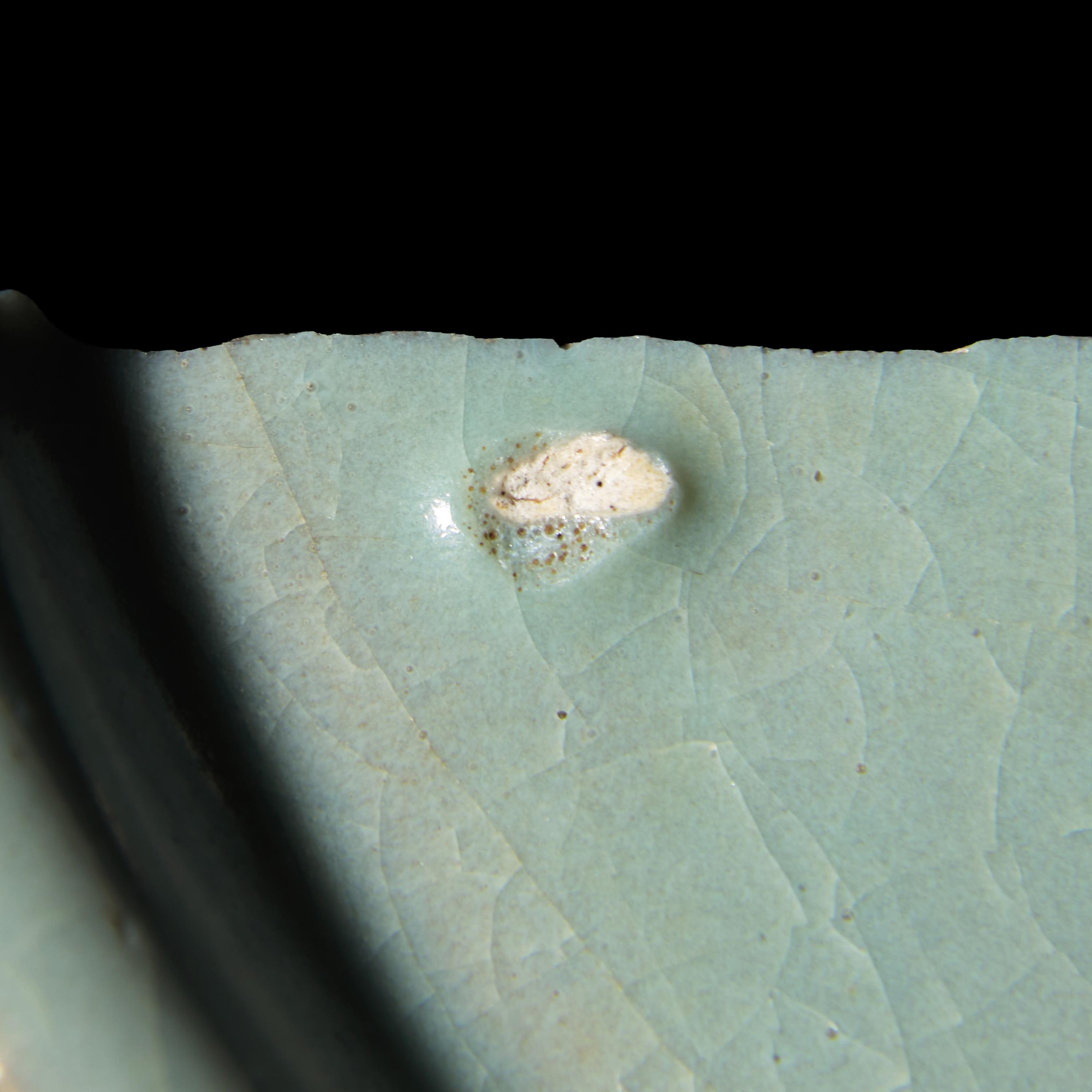 Two Chinese Celadon Glazed Ceramic Fragments, Song Dynasty — 宋 汝窯及官窯帶支釘瓷片兩枚