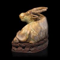 A Large Chinese Celadon and Beige Jade Buffalo, 18th/19th Century 清中期 青玉臥牛