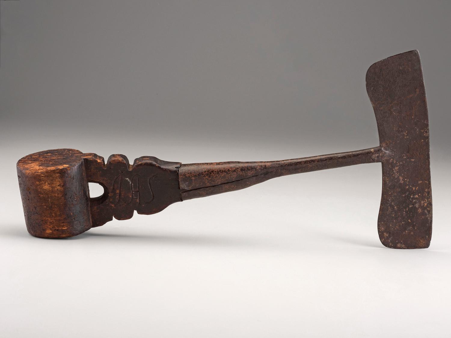 A Carved Wood and Iron Whaling Tool