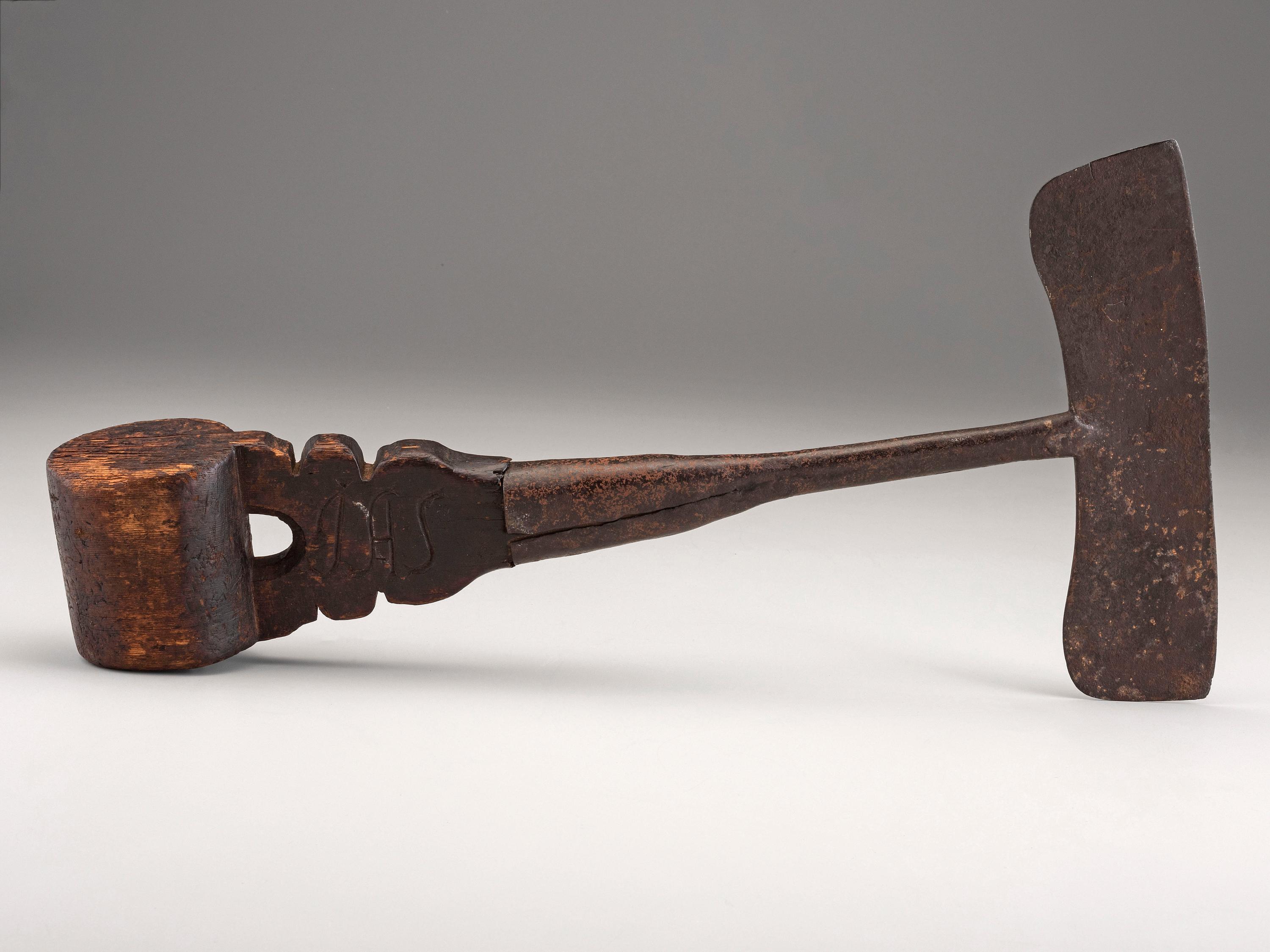 A Carved Wood and Iron Whaling Tool