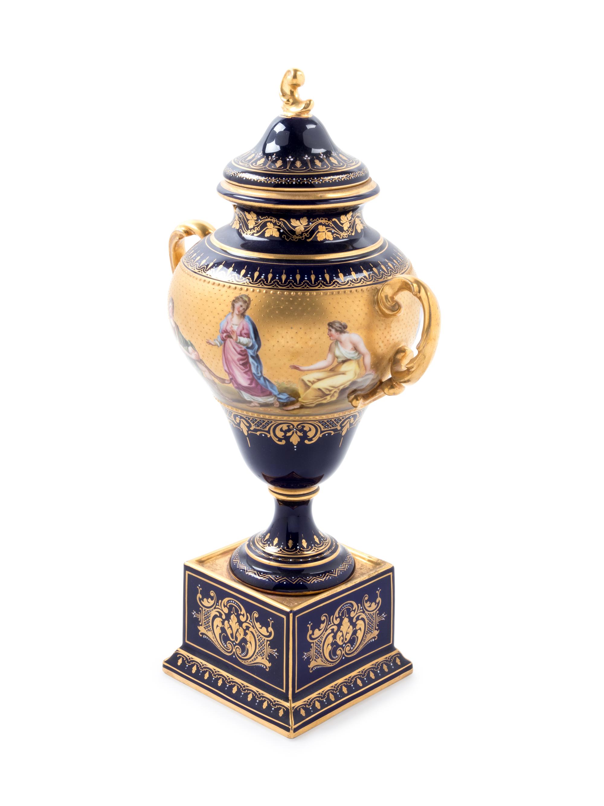 A Vienna Style Painted and Parcel Gilt Porcelain Covered Urn on Stand