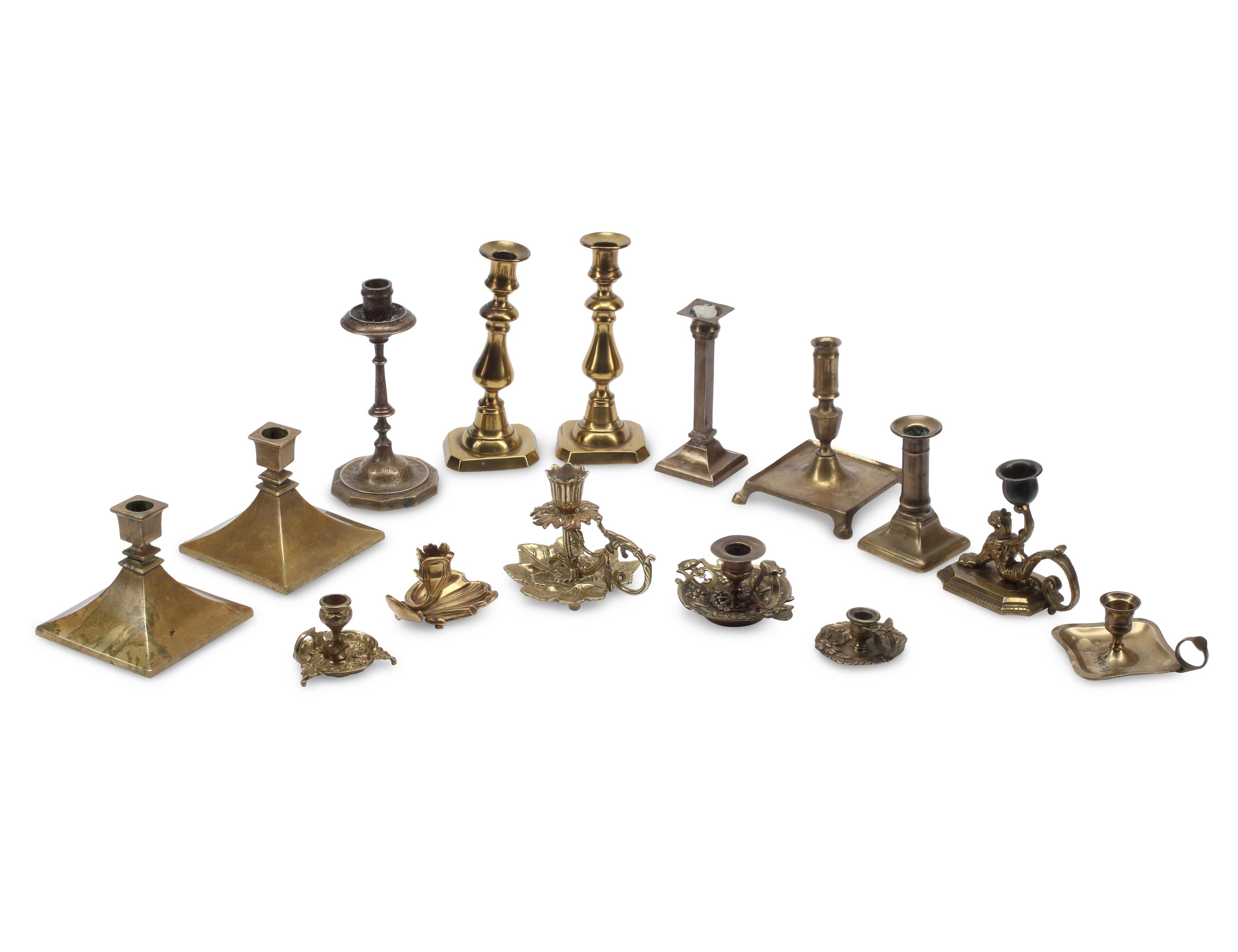 A Collection of Brass Candlesticks