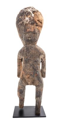 An African Carved Wood Fetish Figure. Height 21 1/2 x width 6 x depth 5 1/2 inches.