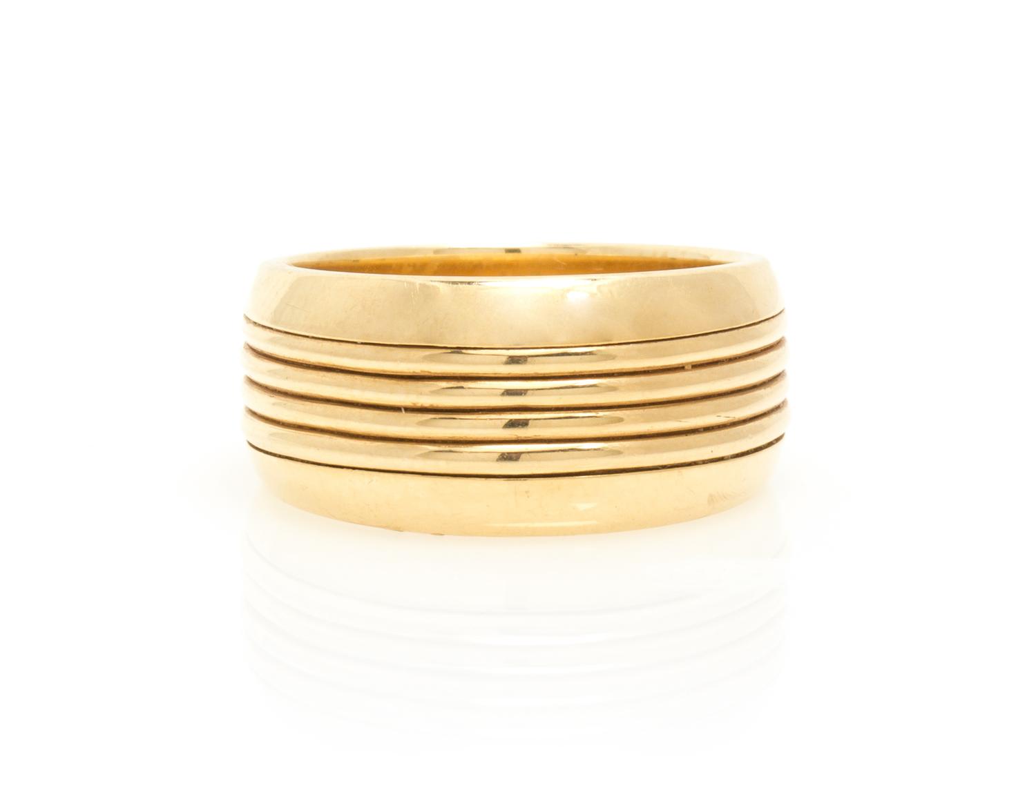 A 14 Karat Yellow Gold Banded Ring, Krementz. 6.10 dwts.