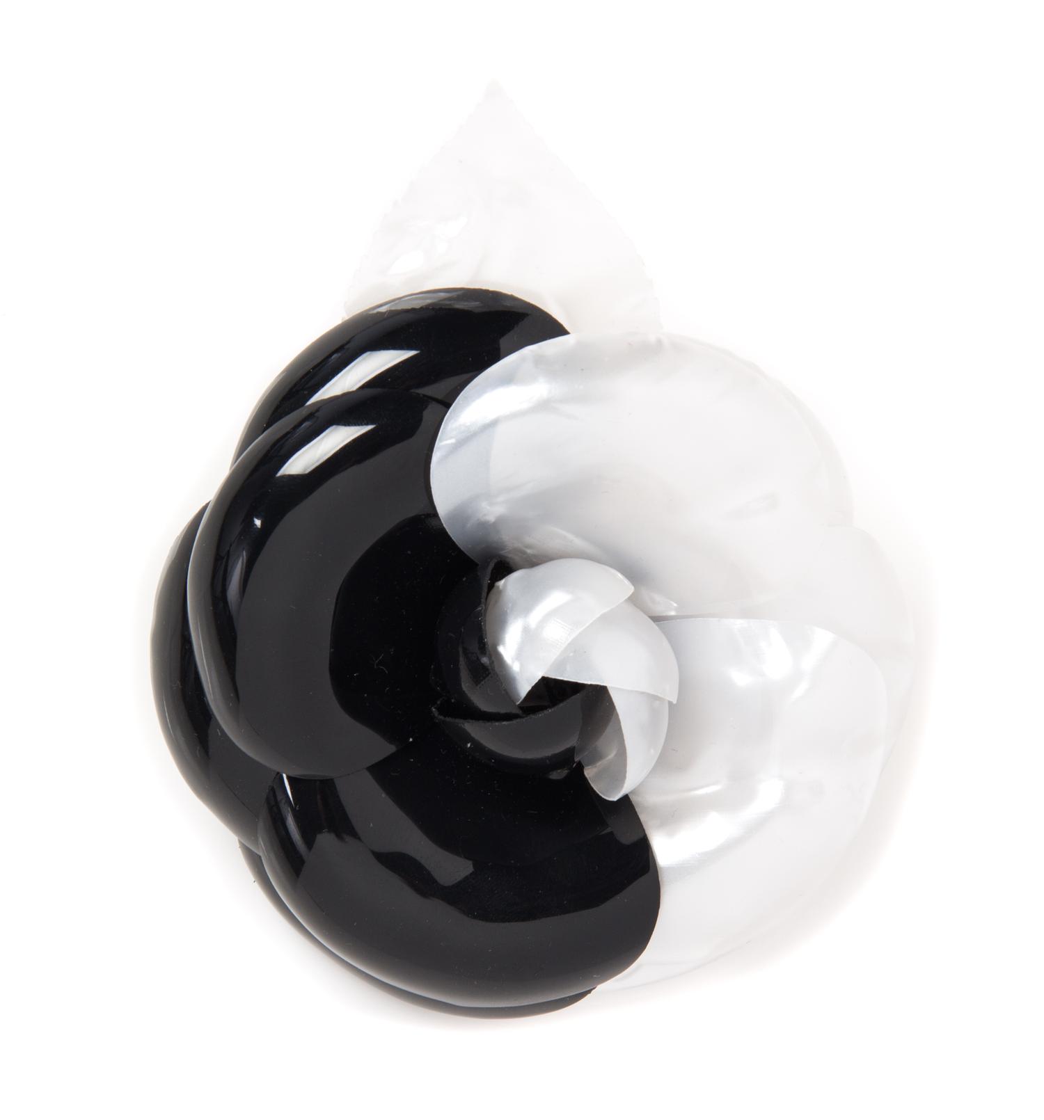 A Chanel Black and White Resin Brooch, 5" x 4".