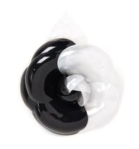 A Chanel Black and White Resin Brooch, 5" x 4".