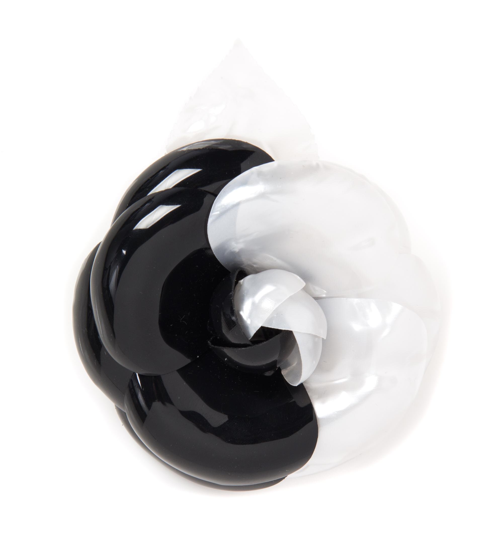 A Chanel Black and White Resin Brooch, 5" x 4".