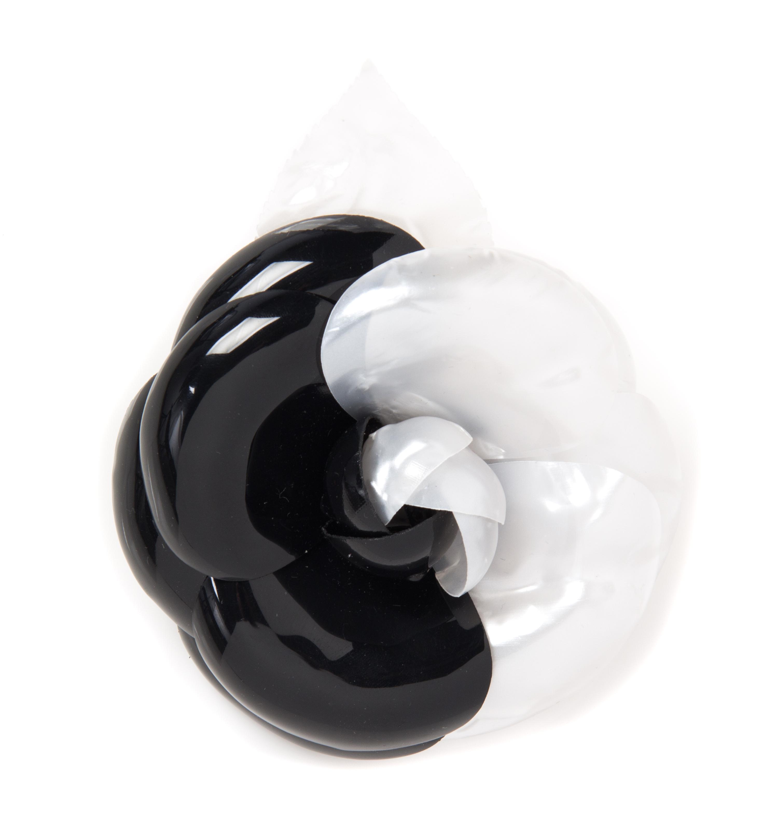 A Chanel Black and White Resin Brooch, 5" x 4".