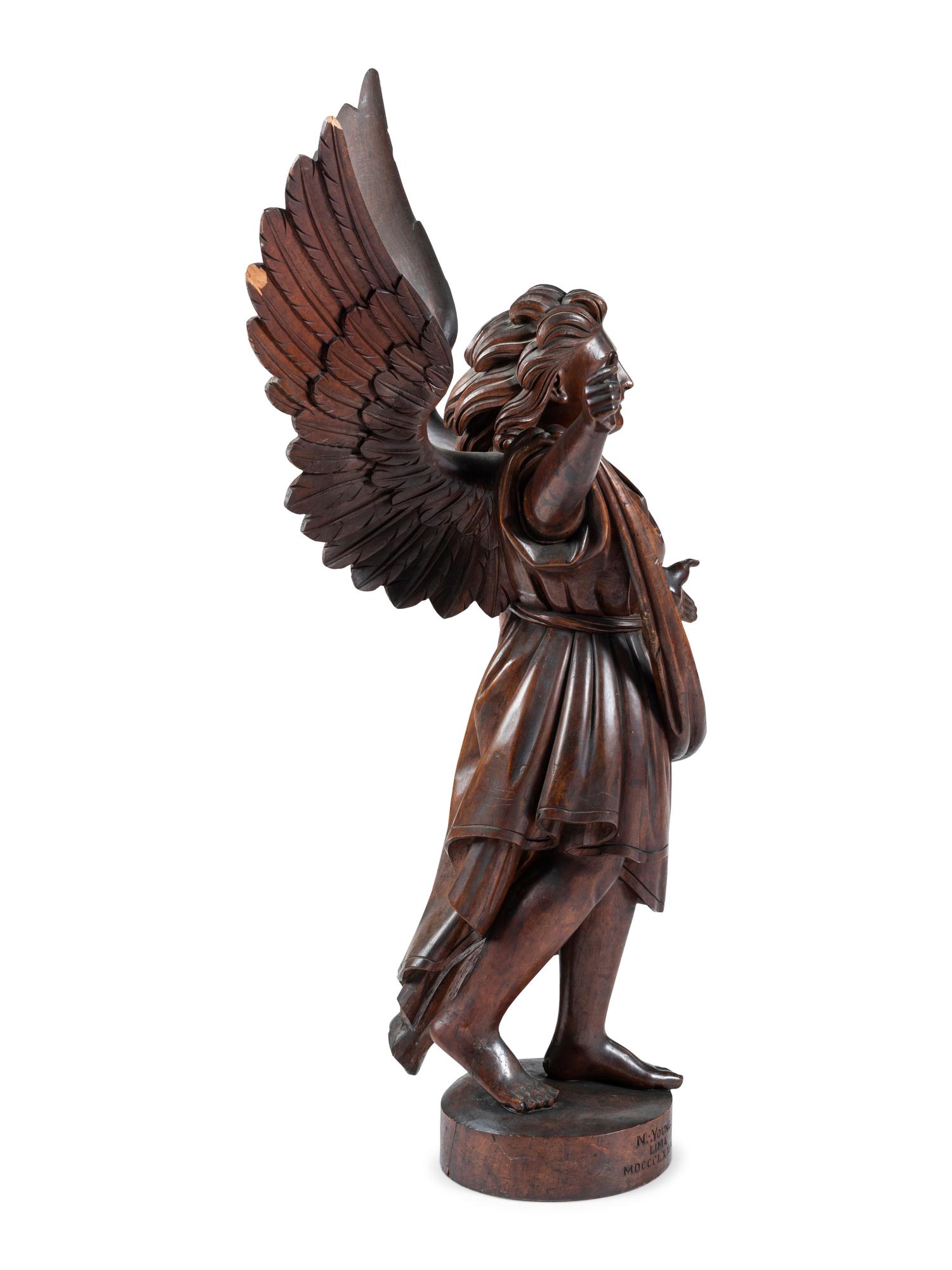 A Carved Walnut Figure of Angel Gabriel
