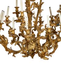 A Gilt Bronze Rococo Style Fourteen-Light Chandelier