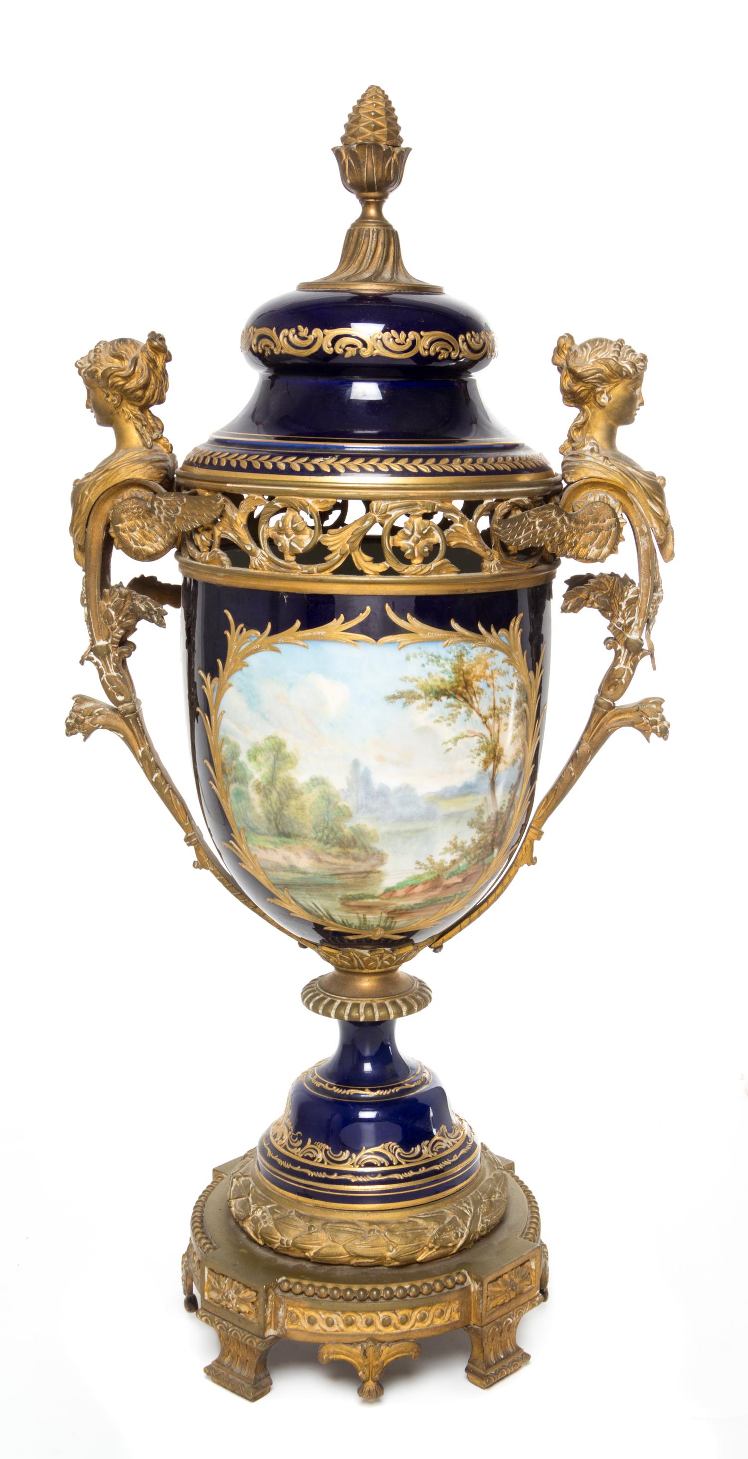 A Sevres Gilt Bronze Mounted Porcelain Urn Height 29 1/2 inches.