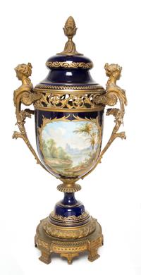 A Sevres Gilt Bronze Mounted Porcelain Urn Height 29 1/2 inches.
