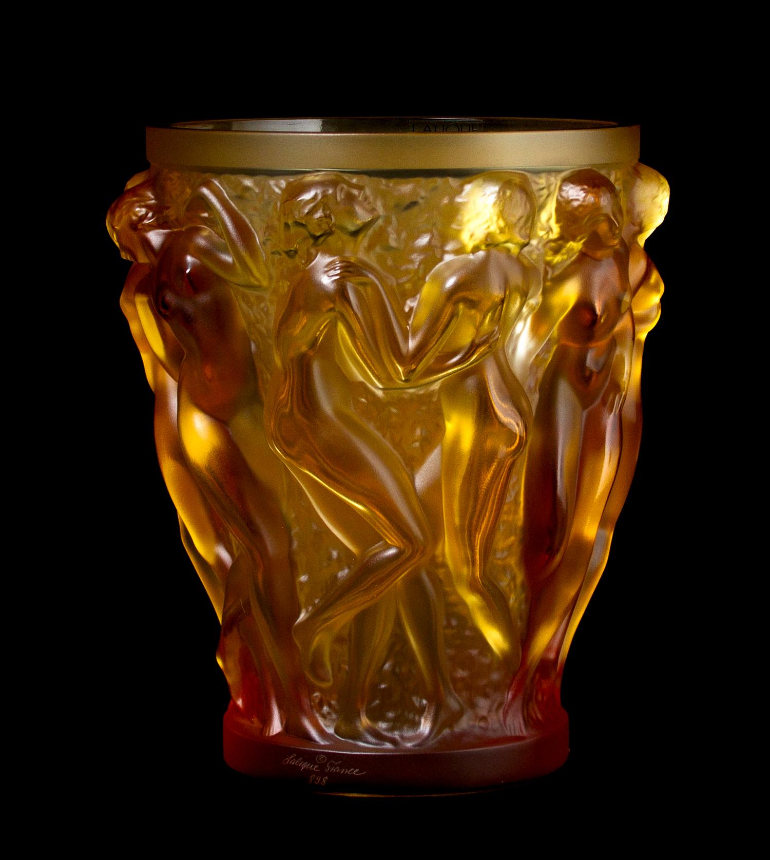 A Lalique Molded and Frosted Amber Glass Vase, Height 9 5/8 inches.