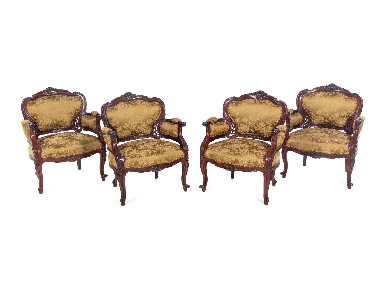 A Set of Four Rococo Style Upholstered Mahogany Armchairs