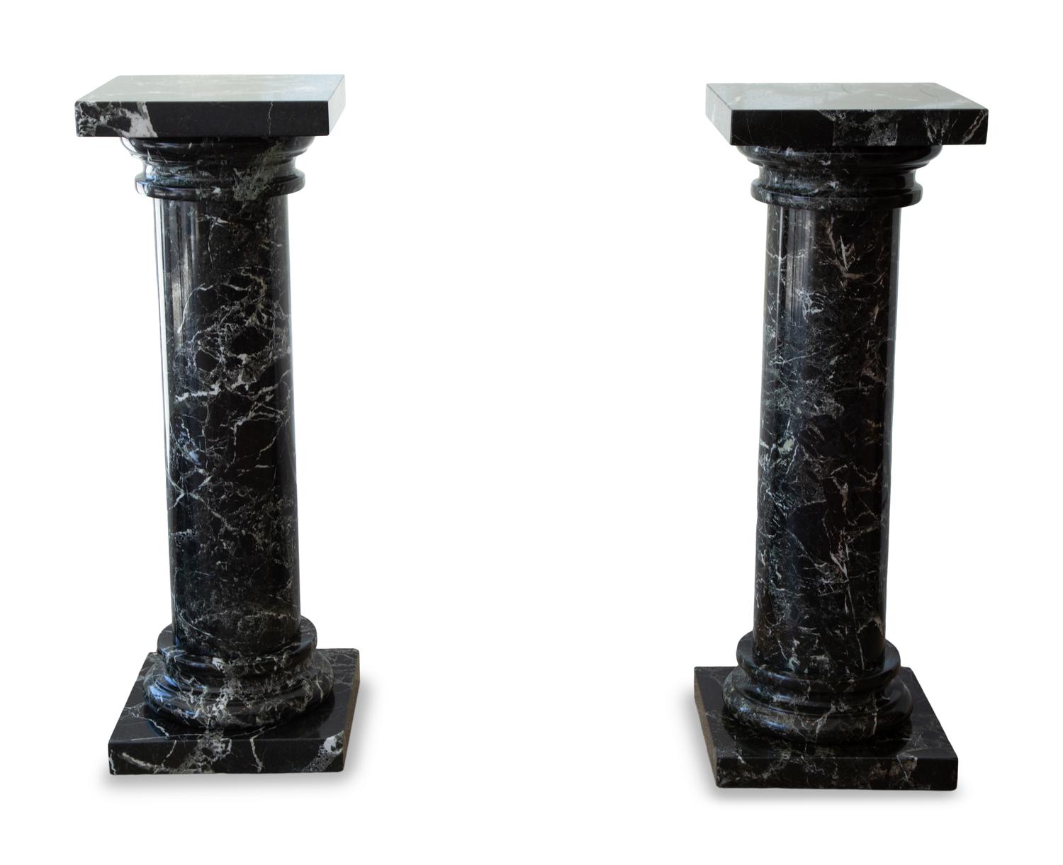 A Pair of Black Marble Pedestals