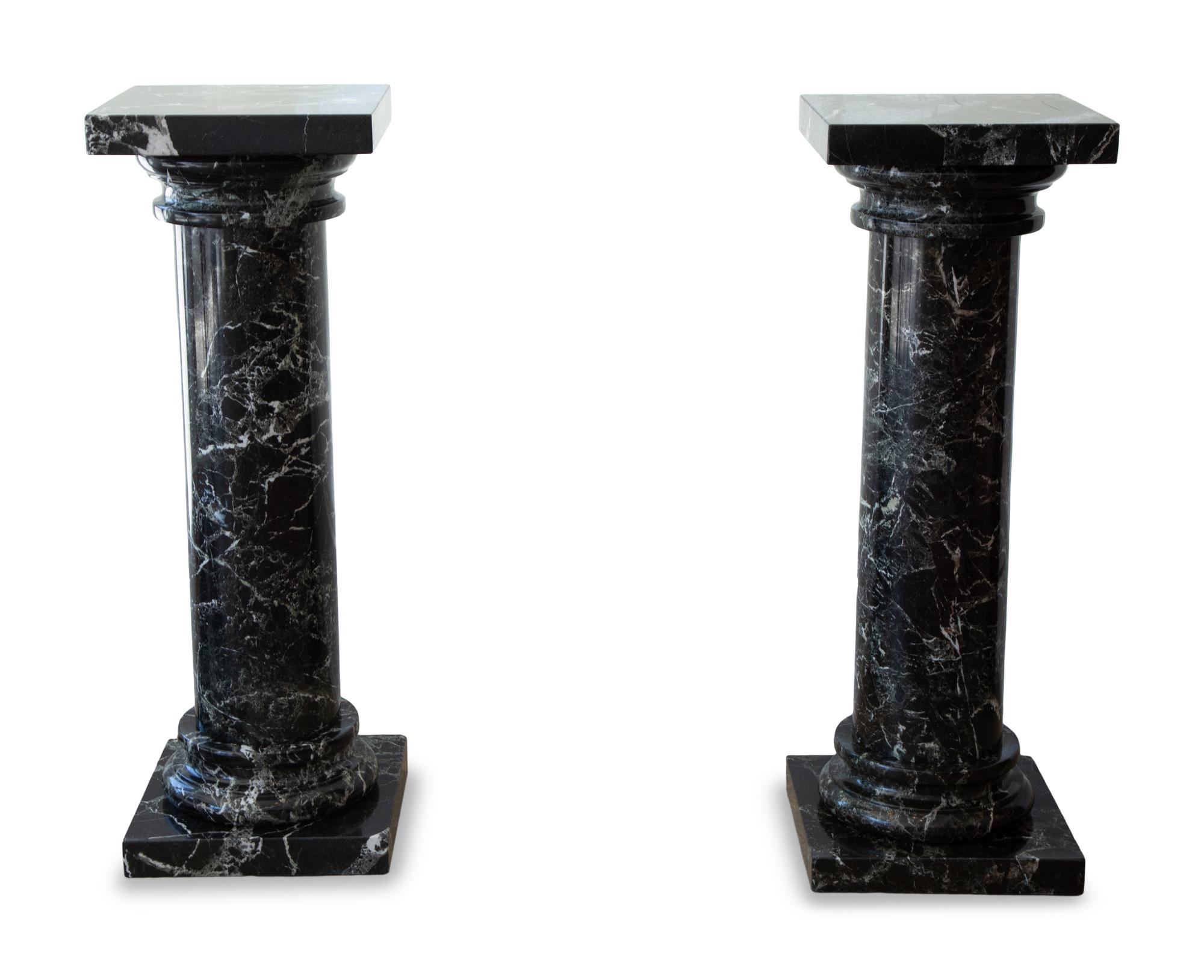 A Pair of Black Marble Pedestals