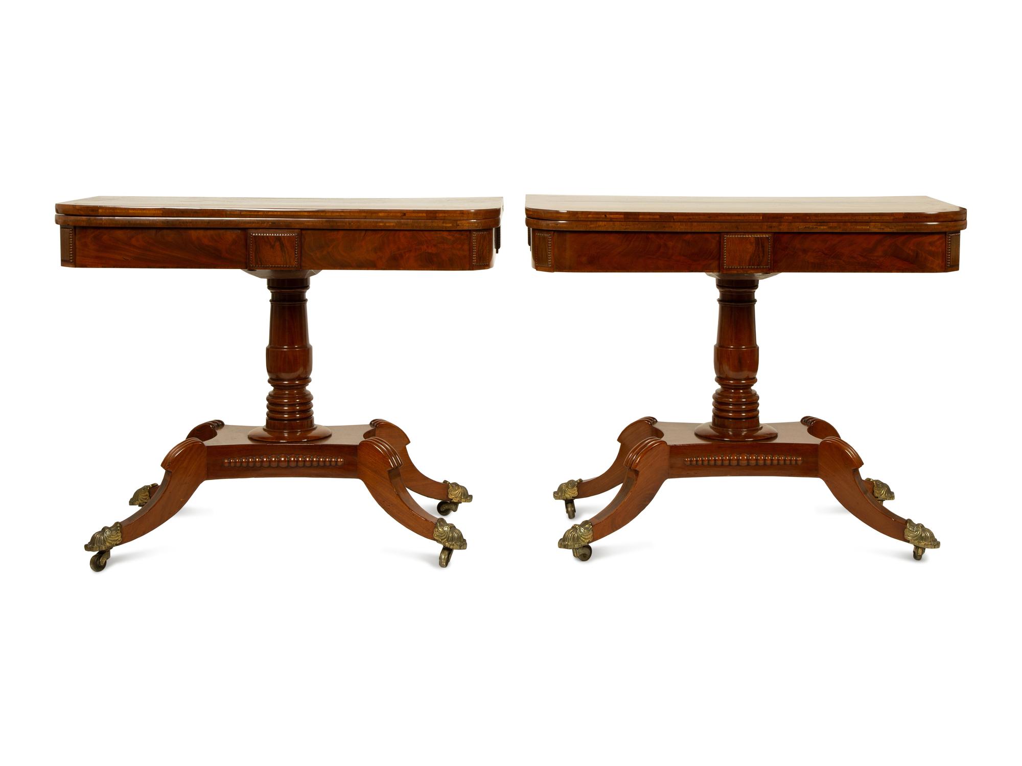 A Pair of Regency Flame Mahogany Flip-Top Games Tables — 19TH CENTURY