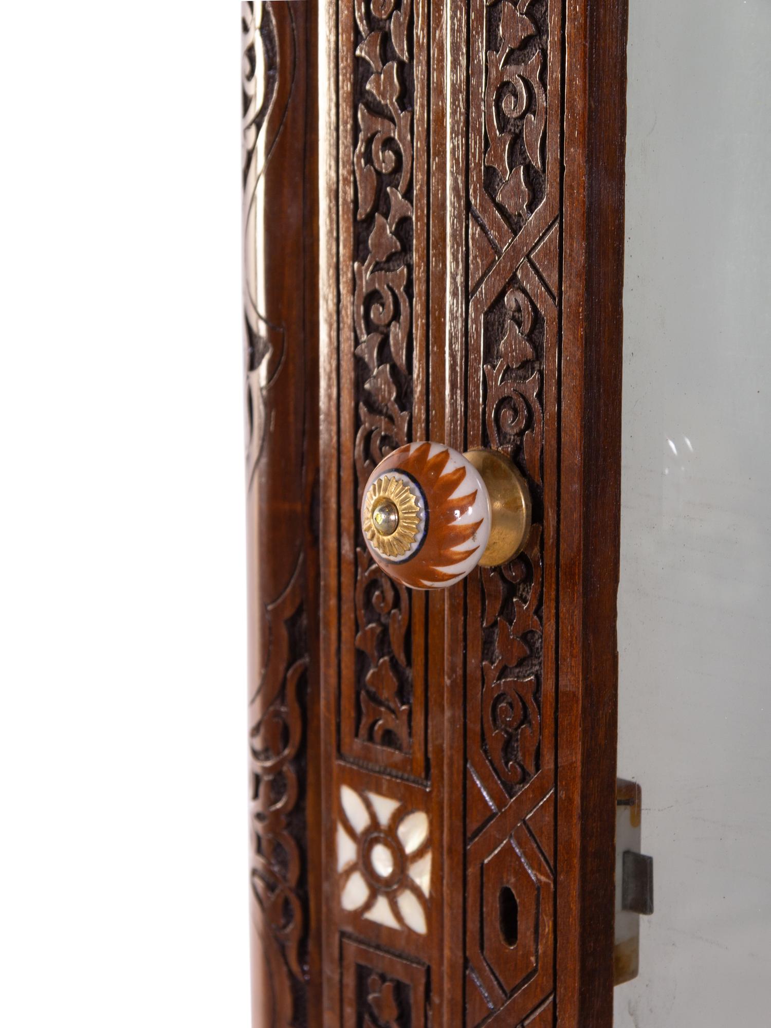 A Syrian Mother-of-Pearl Inlaid and Carved Walnut Vitrine Cabinet