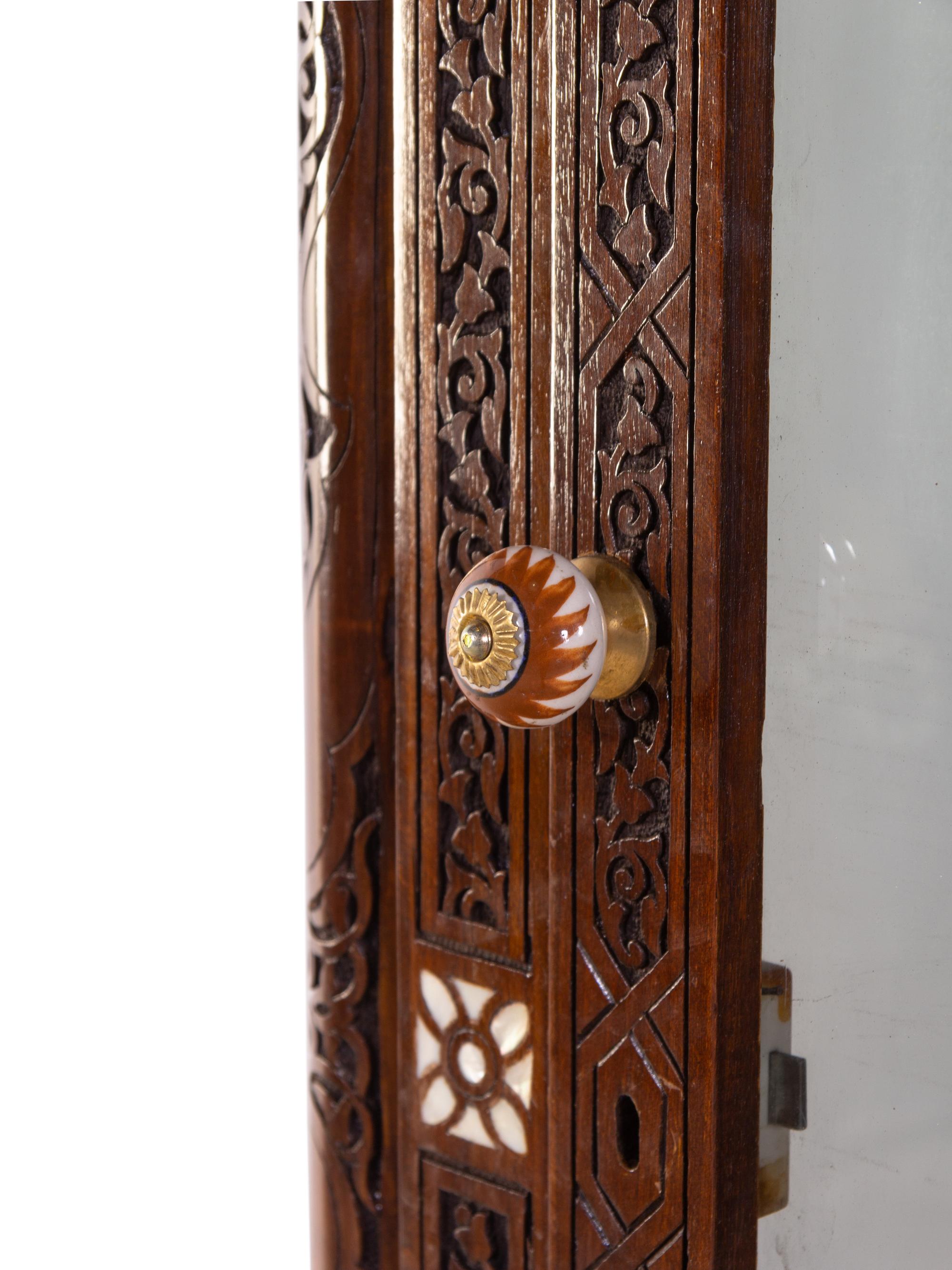 A Syrian Mother-of-Pearl Inlaid and Carved Walnut Vitrine Cabinet