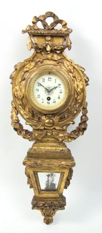 A Neoclassical Giltwood Cartel Clock, Height overall 25 1/2 inches.