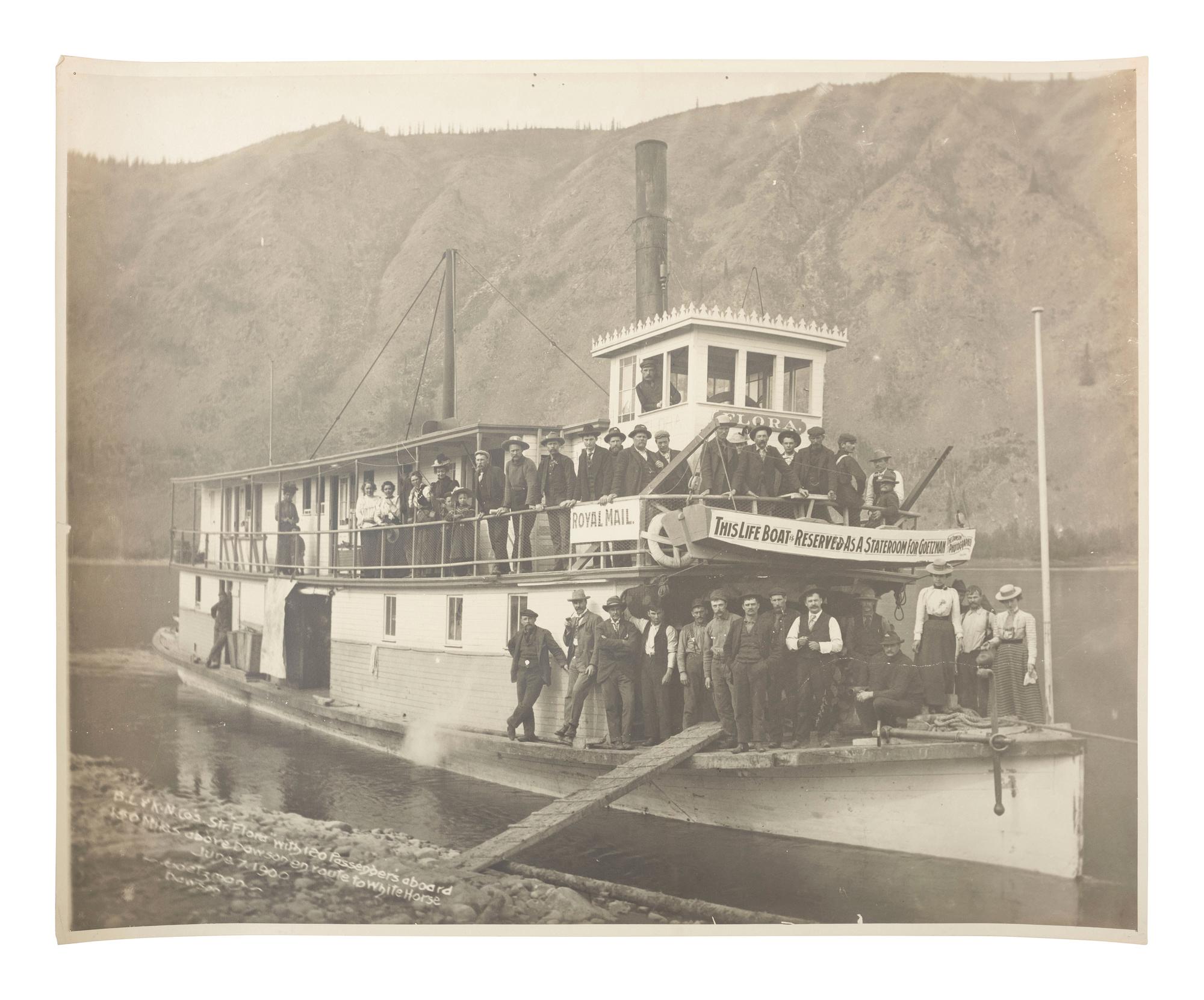 Klondike Gold Rush GOETZMAN, Henry J. (b. 1864), Mammoth Plate of the Steamer "Flora" with 120 Passengers aboard 150 Miles above Dawson en route to White Horse . Dawson, Yukon Territory: 1900.