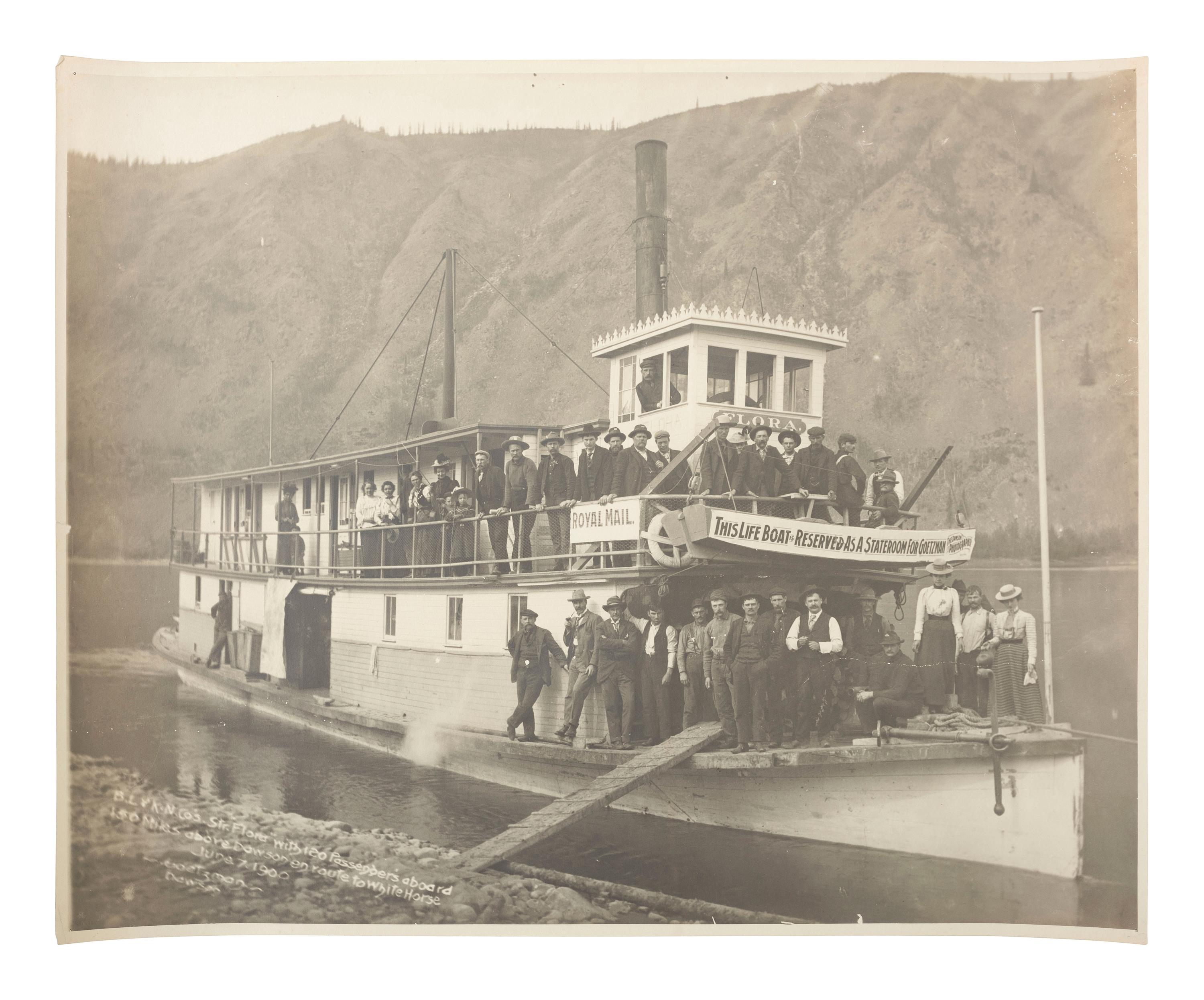 Klondike Gold Rush GOETZMAN, Henry J. (b. 1864), Mammoth Plate of the Steamer "Flora" with 120 Passengers aboard 150 Miles above Dawson en route to White Horse . Dawson, Yukon Territory: 1900.