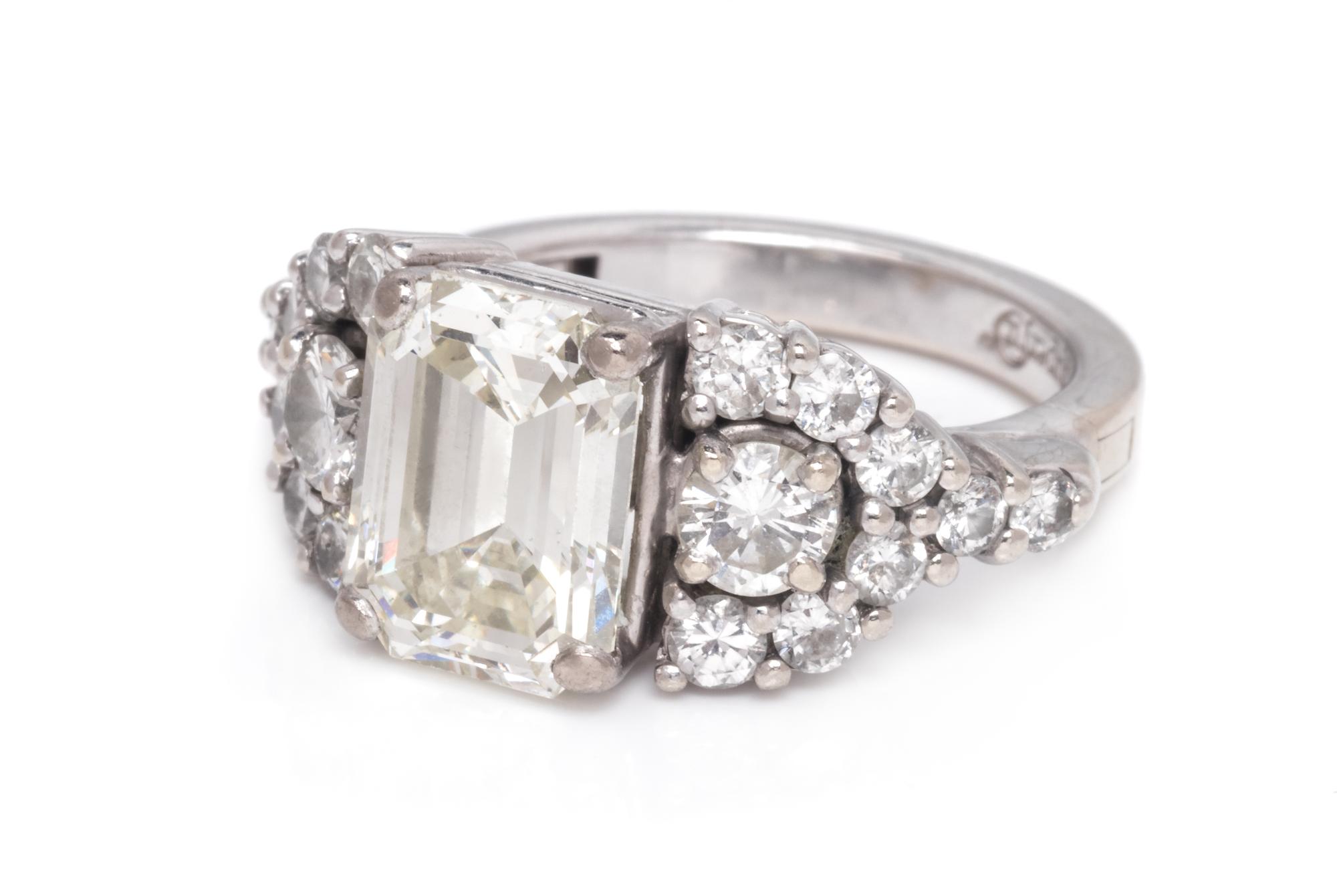 A 14 Karat White Gold and Diamond Ring,