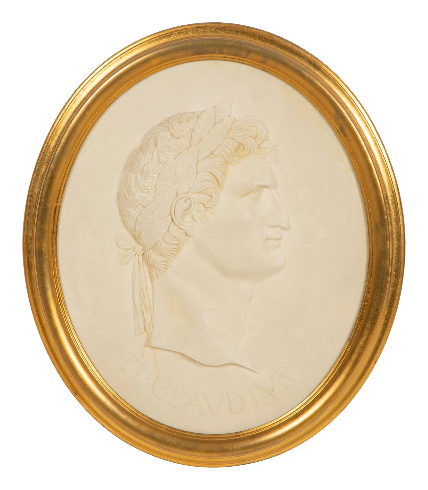 A Pair of Roman Style Composition Relief Plaques in Giltwood Frames