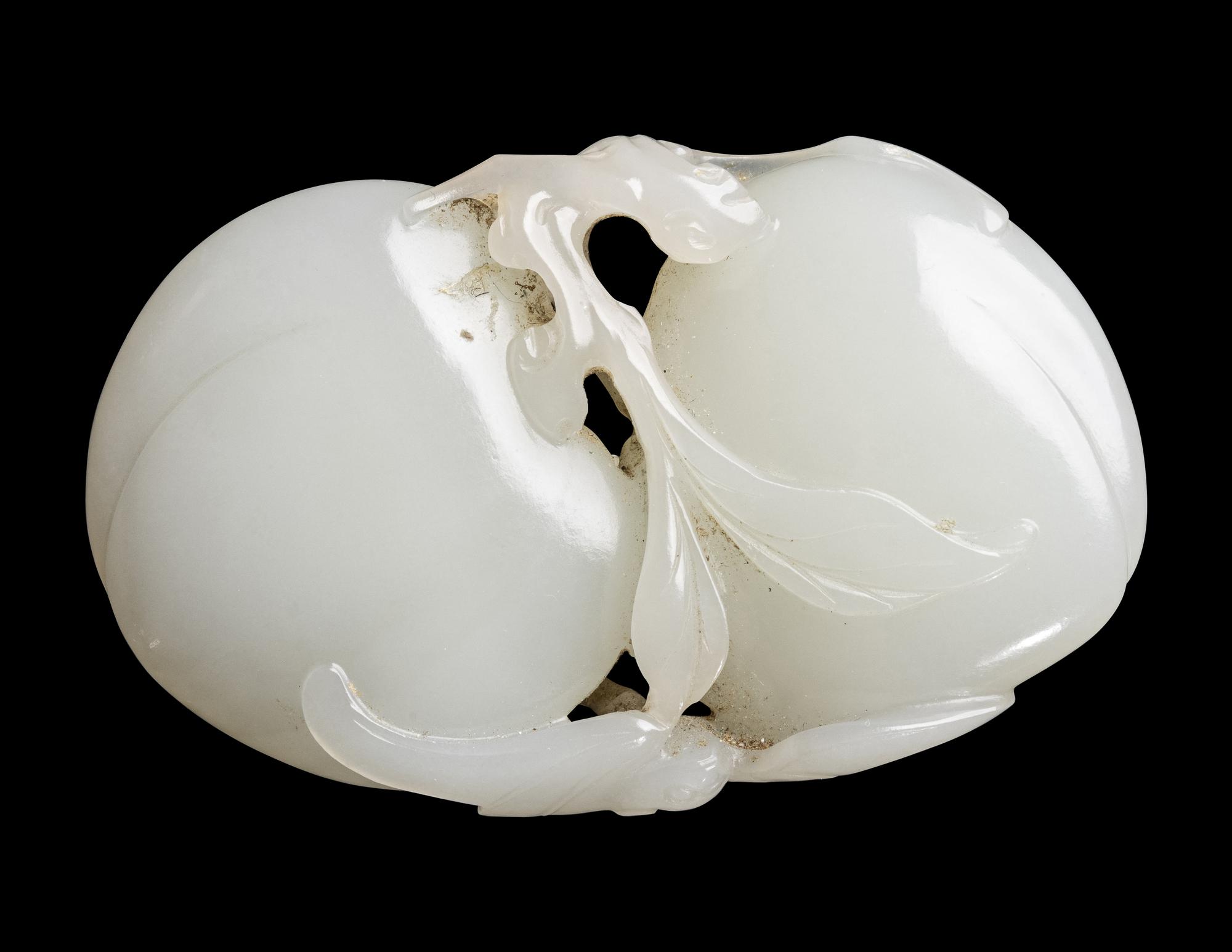 A Chinese Pale Celadon Jade 'Double Peaches' Carving