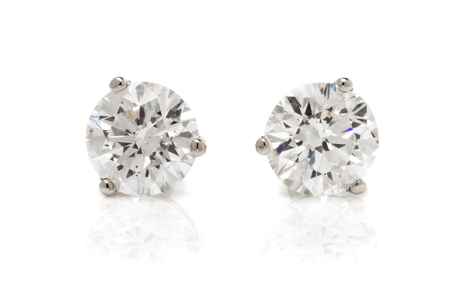 A Pair of 14 Karat White Gold and Diamond Stud Earrings, 0.60 dwts.